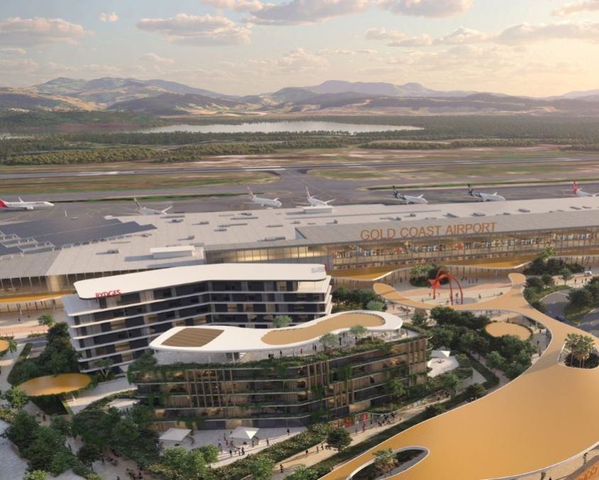 Illustration of Gold Coast Airport’s future master plan featuring a modern terminal, hotel, landscaped public spaces, and integrated green architecture.
